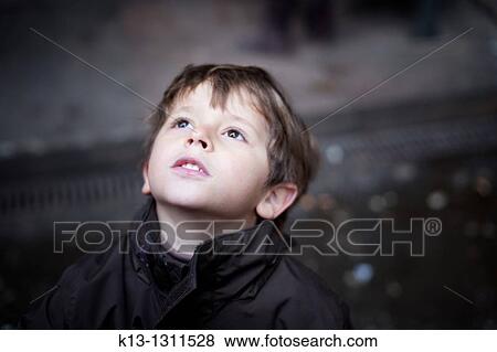 Child looking at the sky View Large Photo Image Stock Photo - Child looking at the sky. Fotosearch