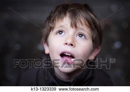 Child looking at the sky View Large Photo Image Stock Photo - Child looking at the sky. Fotosearch