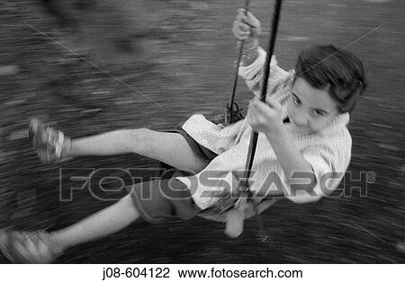 Child on a swing View Large Photo Image Stock Image - Child on a swing. Fotosearch