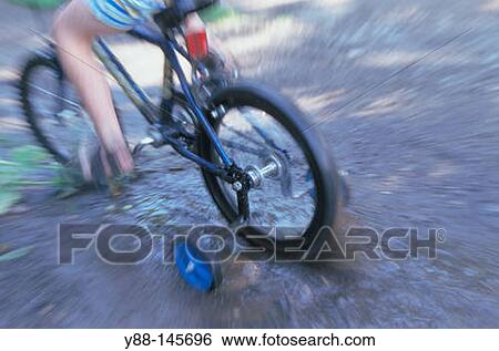 Stock Photograph - Child on bicycle. Fotosearch