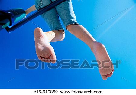 Stock Photo - child on playground bars. Fotosearch