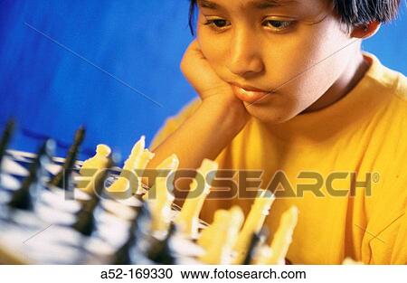 Child playing Chess View Large Photo Image Stock Image - Child playing Chess. Fotosearch
