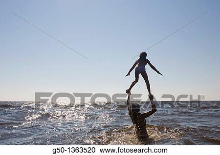 Child Playing with Mom at Beach Bald Head Island, North Carolina View Large Photo Image Stock Image - Child Playing with Mom at Beach Bald Head Island, North Carolina. Fotosearch