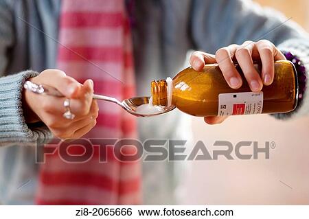 Child pouring cough medicine -close-up. View Large Photo Image Stock Photograph - Child pouring cough medicine -close-up.. Fotosearch