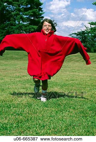 Stock Photo - Child running in an adult coat. Fotosearch