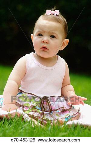 Child sitting outdoors View Large Photo Image Stock Photograph - Child sitting outdoors. Fotosearch