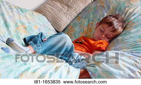 Child sleeping on a couch View Large Photo Image Stock Photography - Child sleeping on a couch. Fotosearch