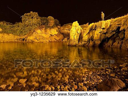 Stock Photo - Child statue over El Pedregal cove, Castro Urdiales, Cantabria, Northern Spain. Fotosearch