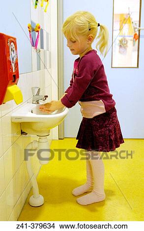 Picture - Child washing hands. Fotosearch