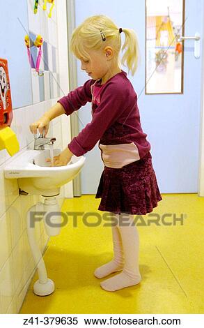 Stock Photography - Child washing hands. Fotosearch
