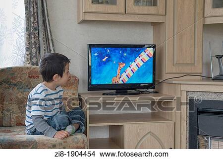Picture - Child watches television. Fotosearch