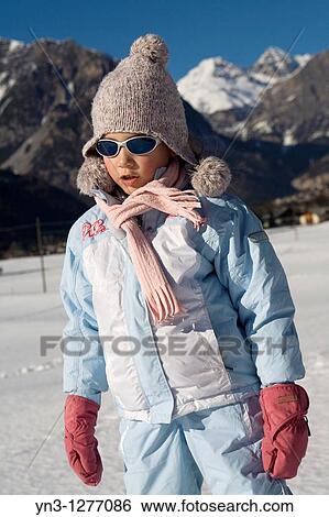 Child wearing ski suit in the Alps View Large Photo Image Stock Photograph - Child wearing ski suit in the Alps. Fotosearch
