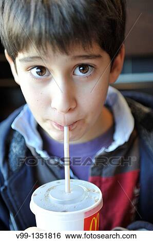 child who drinks a Coke with a straw View Large Photo Image Stock Photograph - child who drinks a Coke with a straw. Fotosearch