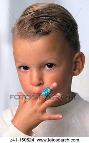 Child with a band-aid on finger View Large Photo Image Picture - Child with a band-aid on finger. Fotosearch