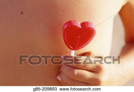 Stock Image - Child with a lollipop. Fotosearch