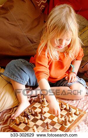 Child with chess boards and chess pieces View Large Photo Image Stock Photo - Child with chess boards and chess pieces. Fotosearch
