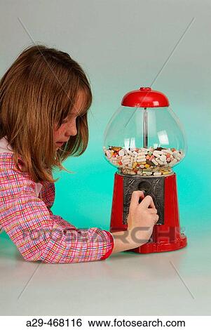 Child with distributor of pills. View Large Photo Image Stock Photograph - Child with distributor of pills.. Fotosearch