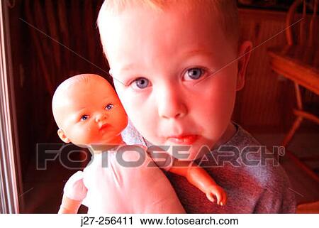 Child with doll View Large Photo Image Stock Image - Child with doll. Fotosearch
