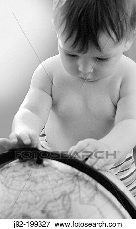 Child with hands on globe View Large Photo Image Stock Photo - Child with hands on globe. Fotosearch