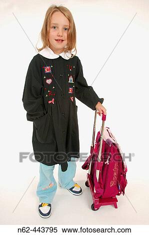 Child with her backpack on small wheels. View Large Photo Image Stock Photography - Child with her backpack on small wheels.. Fotosearch