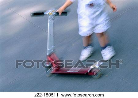 Child with scooter View Large Photo Image Stock Image - Child with scooter. Fotosearch