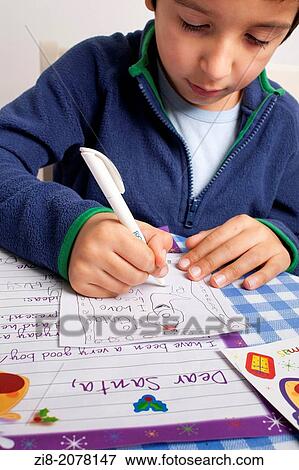 Child writes letter to Santa Claus View Large Photo Image Stock Photo - Child writes letter to Santa Claus. Fotosearch