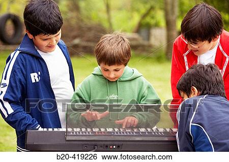 Children (8-12 years old) playing the piano. View Large Photo Image Stock Photograph - Children (8-12 years old) playing the piano.. Fotosearch