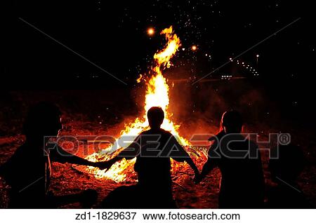 Children are holding hands and dancing in a circle around a bonfire View Large Photo Image Stock Photo - Children are holding hands and dancing in a circle around a bonfire. Fotosearch
