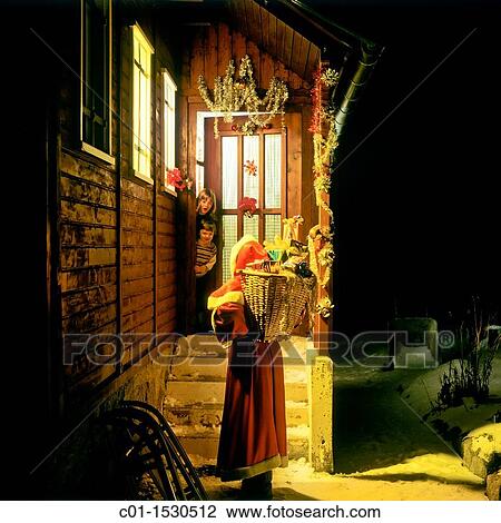 Children at cottage doorway watching Santa Claus arrival View Large Photo Image Stock Image - Children at cottage doorway watching Santa Claus arrival. Fotosearch