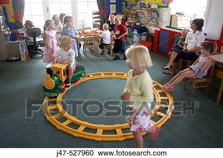 children at nursery, playing at trains in the classroom View Large Photo Image Stock Image - children at nursery, playing at trains in the classroom. Fotosearch