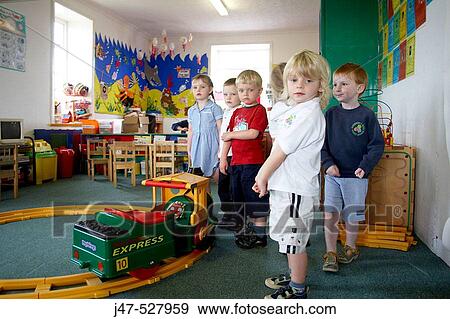 children at nursery, playing at trains in the classroom View Large Photo Image Stock Photo - children at nursery, playing at trains in the classroom. Fotosearch
