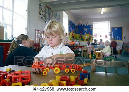children at nursery, playing at trains View Large Photo Image Stock Photo - children at nursery, playing at trains. Fotosearch