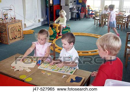 children at nursery, playing at trains and jigsaws View Large Photo Image Stock Photography - children at nursery, playing at trains and jigsaws. Fotosearch