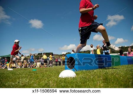 Picture - Children at the annual School sports day at a small primary school, UK. Fotosearch