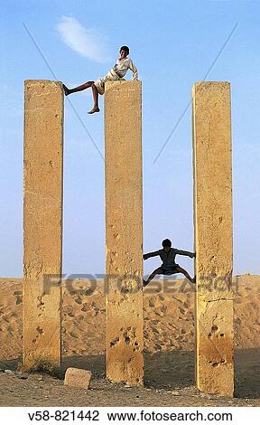 CHILDREN CLIMBING MAHRAM BILKIS TEMPLE, MARIB, YEMEN View Large Photo Image Stock Image - CHILDREN CLIMBING MAHRAM BILKIS TEMPLE, MARIB, YEMEN. Fotosearch