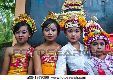 Stock Photo - Children dressed for a ceremony. Religious procession, Ubud, Bali, Indonesia. South-East Asia, Asia.. Fotosearch