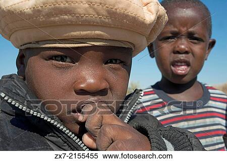 Children dressed in Western clothes at camp Batawana. In the vicinity of Camp Eagle Island Camp by Orient Express, outside the Moremi Game Reserve in Botswana View Large Photo Image Stock Photography - Children dressed in Western clothes at camp Batawana. In the vicinity of Camp Eagle Island Camp by Orient Express, outside the Moremi Game Reserve in Botswana. Fotosearch
