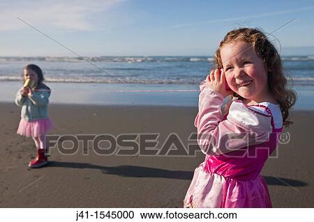 Children experiment with tin can? cell phones?, Sumner beach, Christchurch, New Zealand View Large Photo Image Stock Image - Children experiment with tin can? cell phones?, Sumner beach, Christchurch, New Zealand. Fotosearch