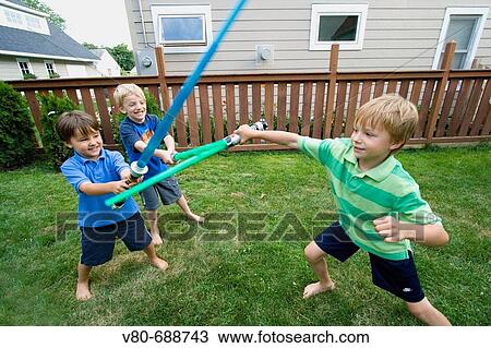 Children fighting with plastic saber swords St Paul Minnesota USA View Large Photo Image Stock Image - Children fighting with plastic saber swords St Paul Minnesota USA. Fotosearch