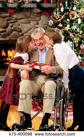 Children giving grandpa kisses and Christmas present View Large Photo Image Stock Photo - Children giving grandpa kisses and Christmas present. Fotosearch