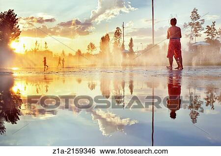 Children having fun with water fountains at Madrid Rio park. Madrid. Spain. View Large Photo Image Stock Photograph - Children having fun with water fountains at Madrid Rio park. Madrid. Spain.. Fotosearch