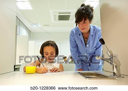Stock Photograph - Children in an orange soft drink tasting session tutored by a sensory analysis specialist, AZTI-Tecnalia Marine and Food Research Center, Derio, Bizkaia, Euskadi, Spain. Fotosearch