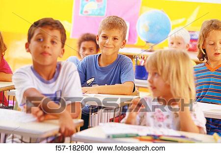 Children in classroom View Large Photo Image Stock Image - Children in classroom. Fotosearch