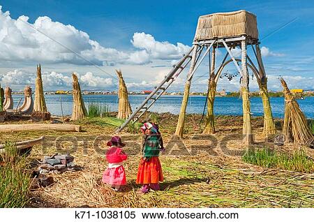 Children in traditional ethnic dress on the floating island of Uros on Lake Titicaca, Peru, South America View Large Photo Image Stock Photography - Children in traditional ethnic dress on the floating island of Uros on Lake Titicaca, Peru, South America. Fotosearch