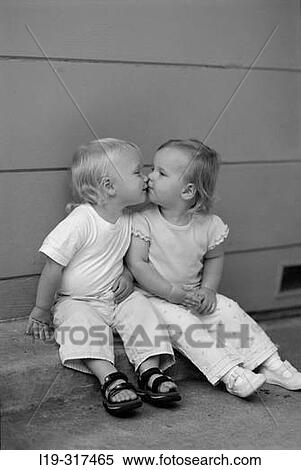 Stock Photography - Children kissing. Fotosearch