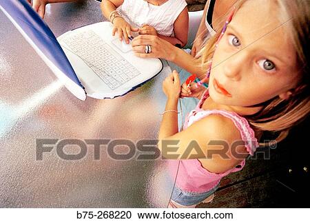 Stock Image - Children learning with a laptop. Fotosearch