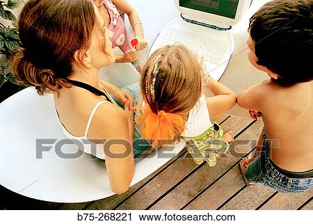 Children learning with a laptop View Large Photo Image Stock Image - Children learning with a laptop. Fotosearch