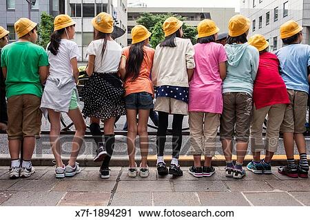 Stock Image - children looking the Sanno Matsuri parade, near the Ichigaya station The parade begins and ends at HieJinja shrine, Nagata-cho Tokyo city, Japan, Asia. Fotosearch