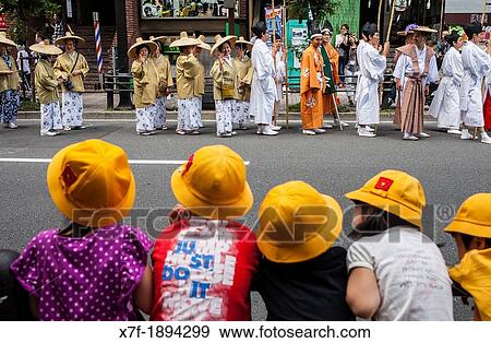 Stock Photo - children looking the Sanno Matsuri parade, near the Ichigaya station The parade begins and ends at HieJinja shrine, Nagata-cho Tokyo city, Japan, Asia. Fotosearch