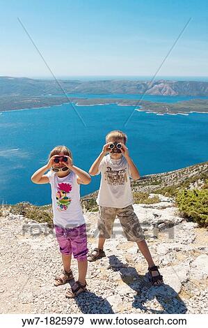 Children looking through binoculars View Large Photo Image Stock Photo - Children looking through binoculars. Fotosearch